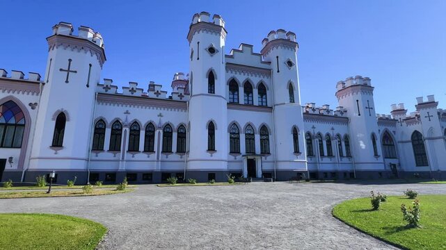 Belarus, Puslovsky Palace, September 5, 2024: Kossovsky Autumn Castle. An old historical castle in Kosovki in sunny autumn weather. An architectural monument in the style of English Neo-Gothic. 4K