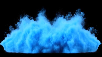 Blue explosion of powder against a black background is shown