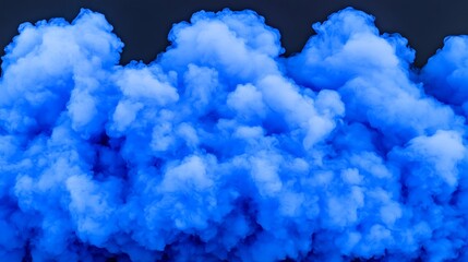 A dense cloud of vibrant blue smoke against a dark background