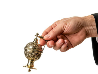 Close-up of a hand holding a silver aspergillum