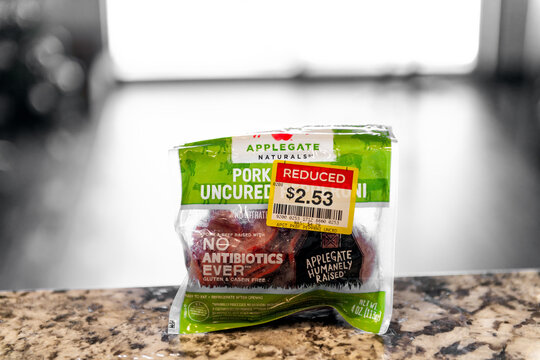 Avon, USA - February 10, 2023: Uncured meat pork and beef label sign text closeup macro Applegate Naturals brand with discount price