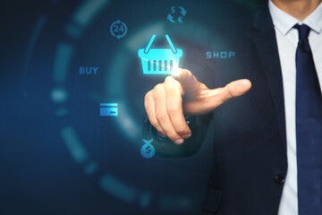 Online store. Man touching shopping basket icon on virtual screen against dark blue background, closeup