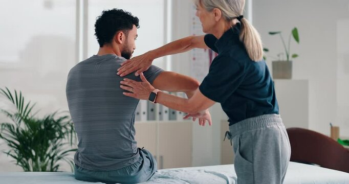 Physiotherapist, patient and shoulder with checkup for consultation, injury or tense muscle at clinic. Chiropractor, client or osteopath helping with sore tension, ache or physiotherapy at practice