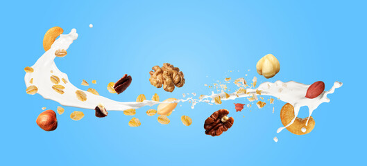 Oat flakes, nuts and splashing milk in air on light blue background. Banner design