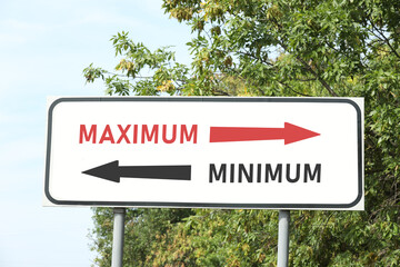 Road sign with different directions - Maximum or Minimum outdoors
