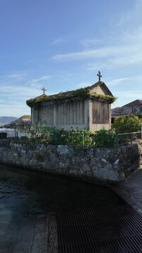 Combarro, horreos and stone crosses overlooking peaceful water in galicia, spain
