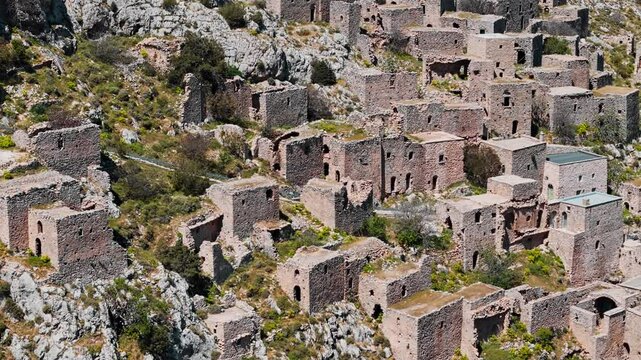 Abandoned ghost town Anavatos with stone buildings on Chios island, Greece