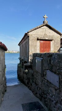 Combarro, horreos and stone crosses overlooking peaceful water in galicia, spain