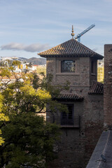 Alcazaba palace lookout tower seen from above with street level below