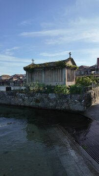 Combarro, horreos and stone crosses overlooking peaceful water in galicia, spain