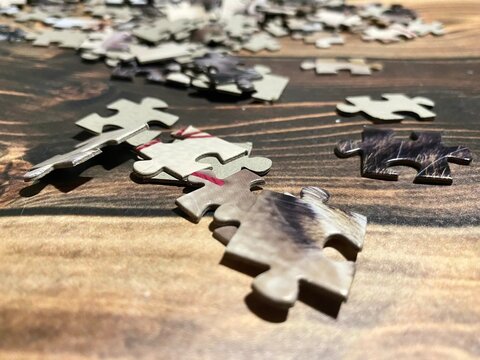 Puzzle pieces on wooden background photo	