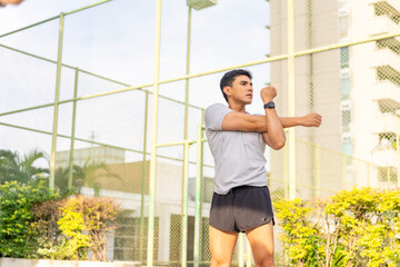Healthy wellness Asian man sport training fitness workout exercise at stadium gym. Young male in...