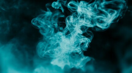 Obraz premium Beautiful ethereal blue smoke billowing and swirling against a dark background