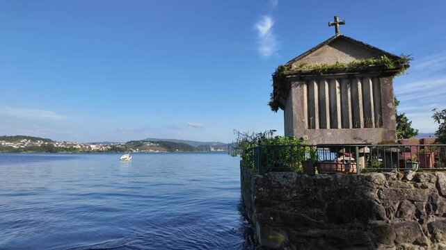 Combarro, horreos and stone crosses overlooking peaceful water in galicia, spain