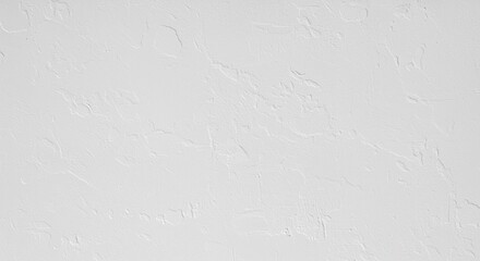 A textured white wall with a subtle pattern, offering depth and character. This minimalist design is ideal for modern backgrounds in various creative projects.