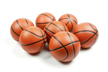 Obraz premium A flock of basketballs isolated on a white background, showcasing vibrant orange color and textured surface, ideal for sports, fitness, and athletic themes.