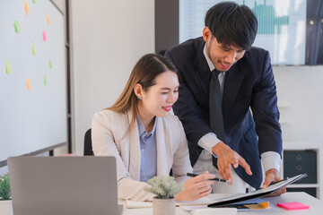 Business Colleagues Discussing Document in Office