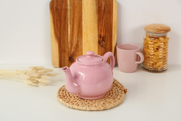 Composition with beautiful tea set and different items on white table