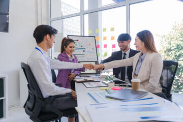 Business Team Handshake in Modern Office