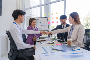 Diverse Business Team Fist Bumping in Meeting