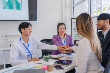 United Business Team Stacking Hands in Meeting