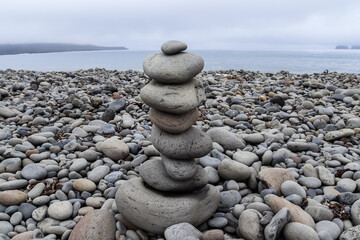 Balancing stones creating a zen atmosphere on a pebble beach in Iceland