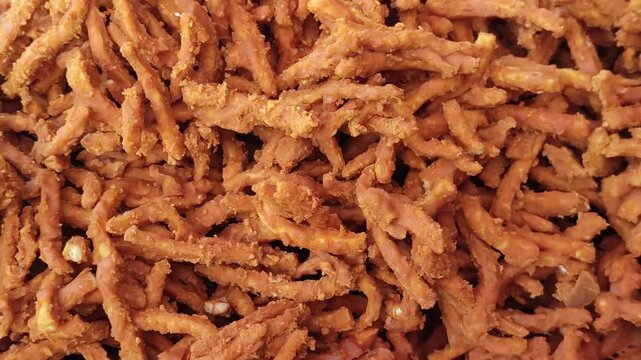 Colorful Bangladeshi sweet street food displayed in traditional market stalls.
