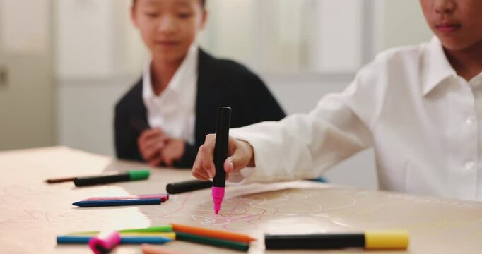 Japanese, hands and child writing for education with language development, literacy game and learning. Kids, students and stationery with fun lesson, english translation and bilingual study in Japan