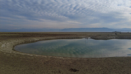 A small puddle of water in a dried-up lake. Lake Burdur, Turkey.