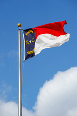 North Carolina state flag waving on the pole in the wind