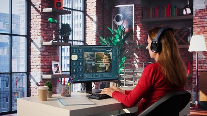 Software developer at home office coding on desktop using AI powered script, building an interface...
