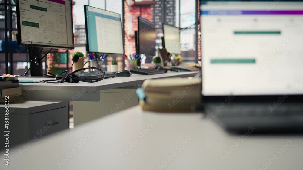 Poster package tracking software and crm appointment schedule app displayed on pc screens in logistics depa