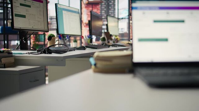 Package tracking software and CRM appointment schedule app displayed on PC screens in logistics department. Computer displays in office showing parcels shipment monitoring and spreadsheets