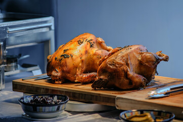 Naklejka premium roasted chicken in party dinner in warm light from hot lamp