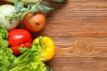 Different fresh vegetables on wooden background