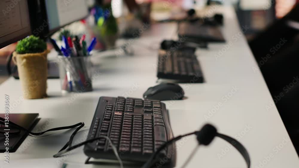 Poster csm system interfaces on computer monitors in empty customer service workplace and call center audio
