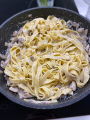 Indulge in this delicious Fettuccine Pasta featuring Chicken combined with a creamy sauce