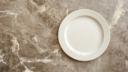 Minimalistic tableware composition with a round white plate placed on a clean, neutral surface.