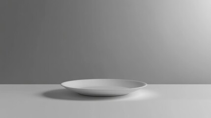 Minimalistic white plate centered on a smooth, clean background, ideal for food presentation and modern dining aesthetics.