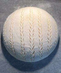 Artistic Bread Loaf Featuring an Intricate and Detailed Scoring Design for Aesthetic Appeal