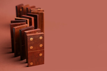 Many wooden dominos blocks on brown background