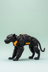 Obraz premium A black and yellow robot cat is standing on a green background