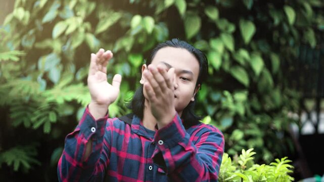 Young Man Mocking with Slow Applause. Young Man Clapping Sarcastically