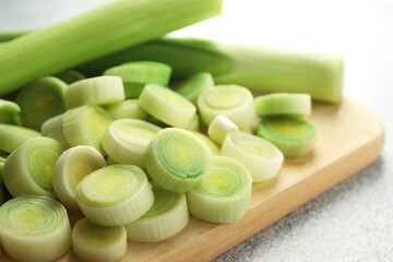 Fresh cut leeks on grey table, closeup