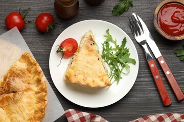 Delicious fresh homemade pie served on wooden table, flat lay