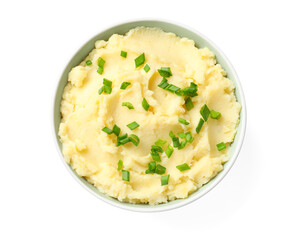 Delicious mashed potato with green onions in bowl isolated on white, top view