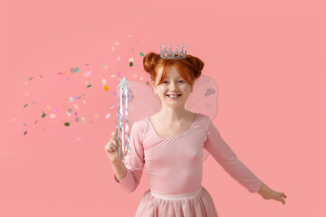 Cute girl in fairy costume with magic wand and falling confetti on pink background