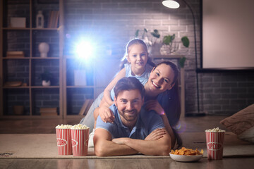 Family during watching of movie together at home