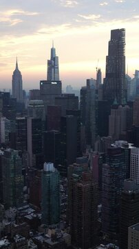 Sunset aerial view to Manhattan Midtown and Downtown at sunset time in New York City
