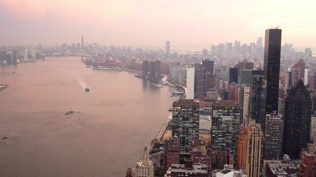 Sunset aerial view to Manhattan Midtown and Downtown at sunset time in New York City